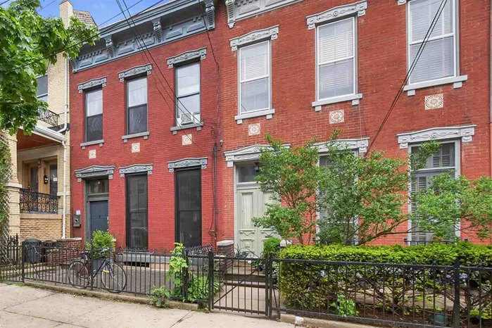 Welcome to this charming 1870'S one family brick row home nestled on the most coveted street in the Jersey City Heights, Ogden Ave. The home features a spacious eat in kitchen, open floor plan living room / dining room with lots of original detail including 11 ft ceilings with medallions, crown moldings, pine plank floors and 2 marble mantles. The second floor has 2 good size bedrooms, one with a marble mantle and 1 smaller bedroom currently used as a home office. There are two full baths, one on each floor. The cozy backyard provides an intimate setting for outdoor relaxation while the large second floor deck, (approx. 11' x 17') overlooking the NYC skyline is the perfect low maintenance outdoor entertaining space! This gem of a home is in the desirable Riverview Arts District  home to artists, restaurants, cafes, nightlife and a vibrant community. Conveniently situated just a half block to the newly renovated Riverview Park with basketball courts, playground & spectacular NYC view, seasonal weekly Farmers Market and more! Just a few short blocks to the Ogden's End Community Garden and Timulty Dog Run. Best location for commuting, near 2nd St Hoboken light rail PATH, 1.5 blocks to NYC bus transportation and convenient to both the Lincoln and Holland Tunnels, NJ Turnpike and all major highways.