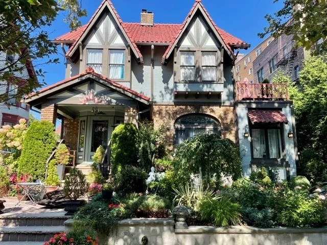 Fall in love with this lovingly restored 1920 Storybook Cottage home, with exotic architecture that incorporates an eclectic variety of styles and outstanding craftsmanship. This gem sits atop the Hudson Palisades with breathtaking views of the NYC skyline and Hudson River from your front porch. Gaze outside from the picture pane floor to ceiling windows at your lush garden with fruit trees, an idyllic setting, only moments away from the famous Blvd East. Natural light illuminates the entire home with an expansive yard and blue stone patio right off your lavish open concept kitchen, boasting a huge white quartz center island, white foil cabinetry, stainless steel appliances, 5 burner stove and hood, silver glass accented backsplash, and deep espresso colored sink with disposal. Radiant heated espresso stained oak hardwood floors accent the parlor level with a magnificent double sided fireplace to cozy up to on cold winter evenings. Additionally, on the parlor level is an office with a separate entrance, laundry area with mud room, and a half bath. On the second floor, there are three bedrooms plus a large walk-in closet, (formally a bedroom). The third floor attic level has another bedroom, with an office area and a full bath. This extended family home has a freshly painted finished walk-out lower level with a one bedroom apartment, summer kitchen/wet bar, cherry cabinetry, marble countertop, spectacular spa-style bath with steam room and jetted Jacuzzi. new wine cellar, work room with work sink, and cedar lined double closet, Newly added updates include: House-wide HEPA air filtration system, C/A/C,  73 gallon hot water heater, water filtration system (in kitchen/lower level kitchen), three barrel tiled pointed roofs, drainage system, gutters, irrigation system, windbreaker front door, custom CCTV security system, landscape lighting, exterior task flood motion sensor lighting, exterior outlets, and extra heavy steel support beams allowing for an addition of another story. Other accents include: salvaged and custom wood shelving, stone tile floors in baths with glass enclosed showers, leaded glass transom, and porcelain door knobs throughout. Close to the NYC bus, Lincoln Tunnel, Port Imperial Ferry, Hoboken border, supermarkets, waterfront walkway, Whole Foods, Trader Joe's and shops. There is a 1+ car parking space for your convenience. Make this your dream home now!