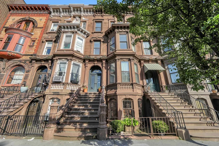 Truly a Rare find: 4, 000 sq ft approx. of Expertly restored, renovated living space! 538 BERGEN AVENUE offers the perfect coexistence of Modern conveniences & the opulence of The Gilded Age. Prime location in McGinley Square, Bergen Hill. This Historic Brownstone Mansion features 4 main floors on a massive 20' x 100' ft. lot. Garden level~ Living/Dining room leading into the fully updated Kitchen featuring Viking & Bosch appliances, Custom Sandkamp cabinets and a pathway to the private Backyard. Grand Parlor level~ 2 oversized Versatile Living/Dining rooms with 12 foot ornate coffered ceilings featuring Crown moldings, Medallions, Pocket Doors, Antique Style Crystal chandeliers as well as exquisitely mirrored Marble Mantelpieces. The top 2 floors feature the Primary Bedroom suite w Alcove, 3 additional Bedrooms, 2 fully renovated Full Baths, a Sitting room/Office, a huge walk-in Cedar closet & laundry area. In the lower level find a Spa experience with Sauna, Full Bath, Bonus room & 2nd Laundry. Premium Weil McLain Heating system throughout. In Total: 7 Marble mantle pieces, 7 Chandeliers, Walnut Staircases, intricate Wood flooring, and Stained Glass beautifully decorate this home. Ideally located near iconic Lincoln Park, Farmer's Market, Shopping, all PATH, Lightrail & bus transportation plus so much more. Low Taxes~ $14, 922 annual 2023.