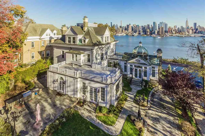 This exquisite rare jewel of a mansion exhibits the world's finest design and historic restoration. It sits on the most unique, spectacular spot in the world overlooking Manhattan and Hudson River. Two-story front entrance featuring Doric columns. The interior boasts elegantly restored architectural features-ceiling medallions, Rococo finished wood working, Ornate working fireplaces, extensive moldings carved in gold applique, finely carved hardwood, stained glass windows, hand painted ceiling frescoes, marble floors, and Tuscan style wine cellar. The Conservatory features a honey onyx floors, wood paneling soaring ceiling's glass dome and wrap around windows. The dining room is decorated with a coffered and faux painted ceiling with beams of gold applique and complements the gleaming herringbone wood floor. The country kitchen comes replete with Viking stove, 2 Viking compactors, 2 Meile dishwashers, and built in Cappuccino and coffee maker. Hand painted tin ceiling, marble mother of pearl and onyx back splash, Hand painted double ceramic sinks. Another fresco covers the second-floor ceiling. Beyond arched columns is a large terrace with panoramic river views. Each 4 bedroom offers quaint decorating, with Venetian plaster walls and fanciful moldings. A two-bedroom, 1.5 bath apartment with a fully upscale kitchen on third floor has its own entrance. Lush landscaping has charming lawns, plantings, Paris street lamps, blue stone patio, gazebo and much much more...Truly one of the most spectacular residences in New York City Area.