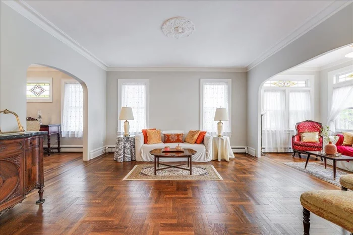The impressive Bayonne home you have been searching for is finally here! 1022 Kennedy Blvd is a sun-filled, stately, brick Colonial, R-2 zoned detached single family home that has the *wow* factor immediately upon entering the marble vestibule with sidelights. Bright and inviting with high ceilings and pristine classic details including aesthetically pleasing architectural details such as: stained glass windows, gorgeous, refinished inlaid hardwood floors, vaulted ceilings, original moulding and windows on 4 sides. 1022 Kennedy Blvd is perfect for a growing family with 3 full floors of living plus basement including 4 Bedrooms / 3 full bathrooms. The first floor is an absolute entertainer's dream... boasting a versatile floorplan with a large, elegant formal dining room that easily accommodates a long table, impressive family great room that extends to a lovely sunroom / sitting area with a relaxing view of the park. Follow the wide hallway to a picturesque open staircase with light from gorgeous stained glass windows to the 2nd floor with 3 perfectly sized bedrooms and a full bathroom. The top 3rd floor is bright and cheery and has such a great and usable layout, similar to a one bedroom apartment. The top floor layout can lend itself to a living room, dining and bedroom area with an updated full bathroom and kitchenette. Prepare culinary delights with ease in the beautifully renovated eat-in kitchen with stainless steel JennAir appliances. Step out of the convenient mud room with 1st floor laundry to a spacious Trex deck overlooking the private lawn & garden area with plenty of room for gatherings, gardening, barbecues & dipping pool. The well maintained basement below leaves plenty of additional storage and/or growth opportunity and includes a 2nd laundry area. Enjoy a garage that accommodates 2 cars and a very long driveway for even more parking. Location! Location! It doesn't get any better than this. Perfectly situated across the street from popular Stephen R.Gregg Park on the waters edge with 100 acres of parkland where you can enjoy Tennis, Basketball, Bocce Ball Courts, Baseball & Soccer Field, Running track, Nature Trail, Bike Trails and more. This home is also only 1/2 block to the Tennis Courts. Easy transport with the bus stop only 1 block away. Rare find and a true must see! Floor plan in pictures. Seize this opportunity!