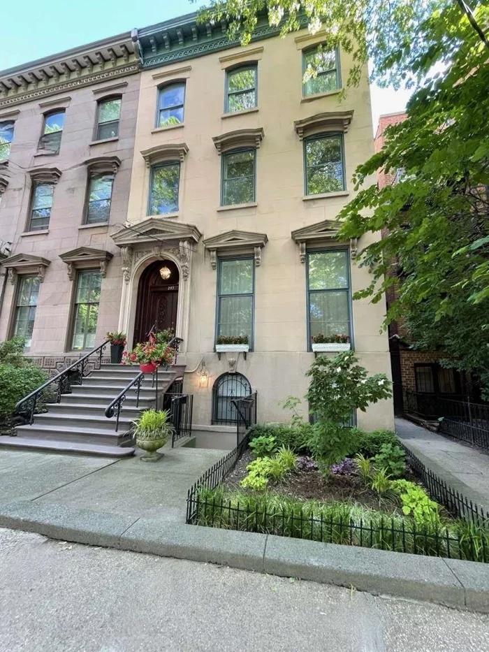 SIZE MATTERS!! (5, 072 sq. feet of living space) especially if you are directly in FRONT OF THE PARK. A truly extraordinary 25' wide Brownstone Townhouse on a 100' deep property, detached on 3 sides. This gem was built across from the center of Van Vorst Park, where the premier townhouses where built along this QUIET tree-lined street (where there are NO buses or two way traffic on this street). This neighborhood is one of Downtown's most culturally and architecturally interesting. It was completely renovated in 2004 and has just undergone an extensive restoration for the past ten (10) months, integrating both boundless elegance yet so easy to live in - the public gathering rooms of this home offer the space and comfort for both grand entertaining and quiet gatherings. The impressive parlor, with floor to ceiling windows consists of a formal and an informal living room, a formal dining room and a spacious eat-in kitchen that overlooks one of the most serine bluestone backyards in downtown. This four (4) story townhouse has five (5) bedrooms, four (4) full baths, four (4) fireplaces, four (4) skylights, along with front and rear gardens. The gracious bedroom floors include a third floor master suite that faces the green canopy of Van Vorst Park along with an abundance of closets. Additional luxuries of this remarkable brownstone includes a possible bonus 2 bedroom, 1 bath lower level apartment that could lease for approx. ($50, 000 annually) to entirely cover the annual taxes and insurance expense, or to host your guests, resident nanny or private home office and gym. 2 laundry rooms, audio/video wiring throughout, multi-zone heat and Central HVAC air conditioning system. Four (4) blocks from the Grove Street Path Station & Restaurant Row. Walking distance from The French American Academy & The Scandinavian School of JC. A townhouse of this size, in this location and condition rarely comes on the market. 293 York Street is one of this neighborhood's true treasures.