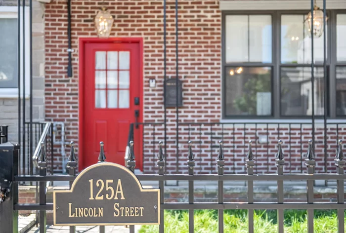 Welcome to 125A Lincoln St! A gut-renovated 4-bedroom, 2 Full Bathrooms, one powder room, two-story row-house-style home with a covered front porch and brick fa ade with a dated front courtyard feel. This exceptional home is located in sought-after JC Heights. It was significantly renovated in 2021 with a Modern Farmhouse ambiance. This open-concept layout has high ceilings and a large center island. Custom kitchen cabinetry and center island with gorgeous quartz countertops, stainless steel appliances including double door refrigerator, dishwasher, gas range oven, customer exhaust hood, microwave. A custom pantry with built-in shelves, a wine refrigerator, and a sliding barn door. In addition to the open kitchen concept, one will find a large living room, dining room area, powder room, and bedroom on the first floor: Herringbone white oak hardwood floors, recessed lights, brass hardware, and wooden beams over the shiplap ceiling. There is access to a beautiful private yard.