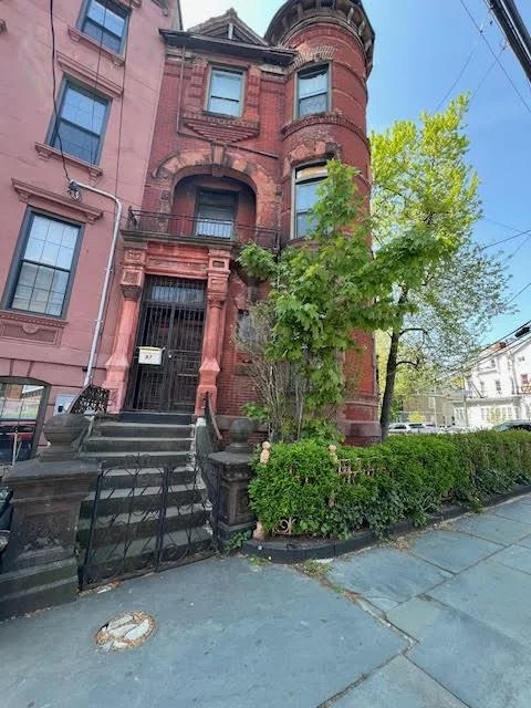 Come and view this Historical Brownstone, timeless elegance and rich history, Italianate style, unique architectural details, classical and charming decor, spacious stoops and large windows with private yard and 3 car parking. High ceilings 11 ft, detailed moldings, fine woodwork throughout the interior, stained glass windows, 8 original fireplaces made from marble/ cast iron, and spiral staircases connecting different levels. There is an estimate of 3, 990 sq ft of living space with original wooden hard floors. Conveniently located within the Journal Square / Bergen Lafayette section, walking distance to PATH trains, buses, and Light Rail to Downtown JC or NYC. Near restaurants, shopping, parks, hospital, schools and St. Peter's University campus. Also, easily accessible to major bridges, highways (Rt 1&9, Rt 440, NJT) and tunnels (Holland/Lincoln). Property will need some TLC. Strictly sold as-is condition.