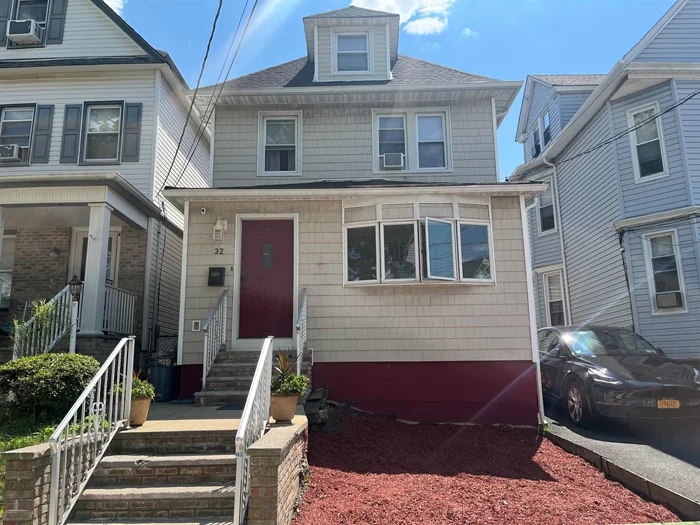 This beautifully renovated Colonial, located in the heart of Bayonne, offers the perfect blend of classic charm and modern luxury. Just five short blocks from the Hudson-Bergen Light Rail station, this home provides easy access to Hoboken and the NYC PATH, making your commute a breeze. This grand residence boasts 4 bedrooms and 2.5 opulent bathrooms, providing ample space for comfort and luxury. Revel in the recent, meticulous renovations which include brand-new siding and a new single layer roof, guaranteeing durability for years to come. The home's electrical system has been upgraded to a robust 200-amp service with all new wiring, catering to all contemporary demands. Every inch of the exterior and interior walls is thoroughly insulated, delivering exceptional energy efficiency and an inviting atmosphere year-round. The cutting-edge tankless on-demand heating and hot water system ensures an endless supply of warmth and comfort. Among the home's many remarkable features is the potential for a splendid mother-in-law suite, offering versatile living space for extended family or esteemed guests. The basement is a marvel of modern engineering, kept impeccably dry by the newly installed French drains, sump pump, and backflow preventer, providing both peace of mind and a wealth of usable space. The outdoor area is nothing short of enchanting. Entertain with flair on the 2-year-old Trex deck, unwind in the luxurious Jacuzzi hot tub, and delight in the garden's various fruiting plants, adding a touch of nature's bounty to your outdoor experience. This home is a symphony of classic Colonial charm and modern conveniences, where every detail has been thoughtfully crafted to create an environment of unparalleled beauty and comfort. Don't miss this extraordinary opportunity to own a piece of Bayonne's finest real estate. This is more than a home; it's a canvas for your dreams and a sanctuary for your soul. Contact us today to arrange a private viewing and step into a world of refined living. Make this magnificent house your forever home!