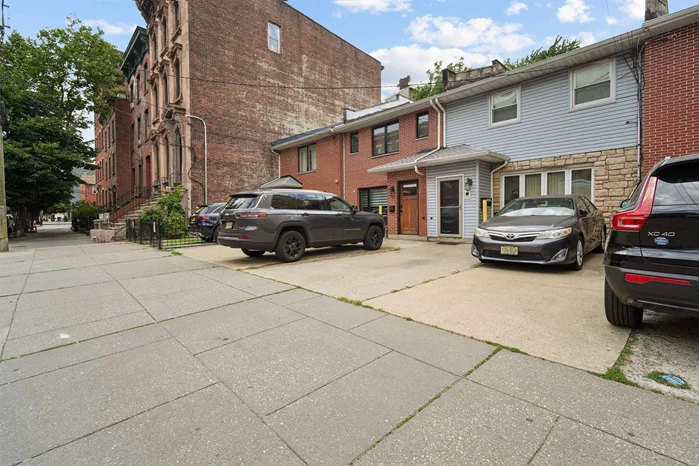 Lovely Single Family Home with 2 Car Parking in Downtown Jersey City!! This Unique 3 Bedroom - 2 Bath Townhouse is nestled in the vibrant Harsimus Cove Neighborhood just minutes from the Newark Ave Pedestrian Plaza, Path Train, and Hamilton Park. Offering over 1600 SF and smartly set back from the thoroughfare to accommodate a convenient front drive, the main level features a generous and efficient floor plan as you make entry via the front foyer with a Spacious Living room, which faces east receiving an abundance of daylight - a Large Modern Kitchen + Dining area, and a gracious Family Room leading to a secluded Deck/backyard creating a true urban oasis. Second level provides 3 bedrooms and full bath. Additional storage is available in the attic space and rear shed!  A must see!!