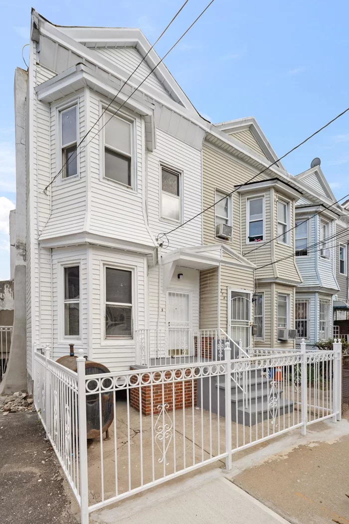 Welcome to 246 Clerk Ave, a beautifully renovated 4-bedroom, 2-bathroom single-family home nestled in the heart of Bergen-Lafayette, Jersey City. Step inside to be greeted by elegant arched entryways that immediately set the tone for the home's distinctive character. The bright and spacious living area features sleek luxury vinyl plank flooring and two charming fireplaces, creating a cozy yet refined ambiance. The open-concept layout seamlessly connects the living and dining areas to a modern kitchen, complete with pristine white cabinetry, stainless steel appliances, and a chic backsplashideal for both entertaining and family gatherings. Each bedroom is filled with natural light and offers generous closet space, providing a serene retreat. The two updated bathrooms feature sleek, contemporary fixtures and elegant tile work, providing a perfect blend of comfort and modern style. Step outside to a private backyard oasis surrounded by lush greeneryideal for summer barbecues, outdoor activities, or cultivating your own garden. Whether you're seeking a tranquil retreat or a lively gathering space, this adaptable area is ready to meet your needs. The partially finished basement, equipped with washer and dryer hookups, offers untapped potential for further customization. Located just a block from the Garfield Ave Light Rail station, providing easy access to major public transportation hubs, including Historic Downtown, Journal Square, Hoboken, WTC, and Manhattan. Minutes from Berry Lane Park and the vibrant Downtown Jersey City, where you'll find superb dining, nightlife, shopping, and more. Ideal for first-time buyers, 246 Clerk Ave offers a move-in-ready experience without the hassle of extensive renovations. Don't miss the opportunity to make this beautifully renovated gem your new home!