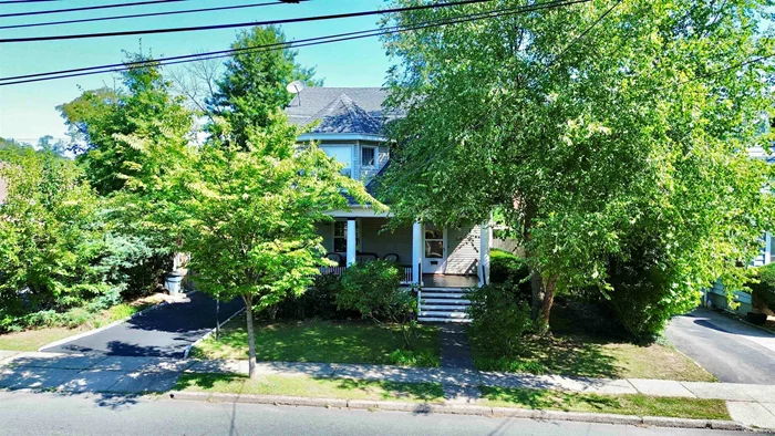 Welcome to this charming colonial home featuring 4 spacious bedrooms & 2.5 baths, including an en suite bath. The dining and living areas flow seamlessly into the updated kitchen and bright breakfast nook. The finished third-floor bedroom provides versatile space for an office or sitting area. Large windows throughout enhance the home's natural brightness and showcase original features like hardwood floors, ceiling medallions, crown molding, and wood-beamed ceilings. The basement includes the washer/dryer, ample storage, and convenient backyard walk out. A privacy fence surrounds the 6-car driveway, leading to a backyard retreat complete with mature shade trees, garden, paver patio, hot tub, and a newly finished two-car garage. Fantastic location near schools, recreation areas, local businesses and easy access to NYC/major highways. This home is a must-see!