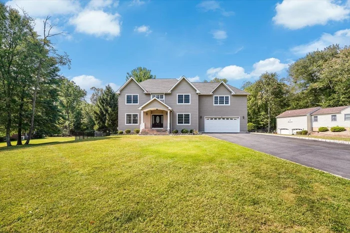 Welcome to this sophisticated home on a 1.12-acre lot in the desirable Foot Hill Area. Offering luxurious living space, this 5-bedroom, 5-bath residence features sunlit rooms with Brazilian cherry hardwood floors, soaring ceilings, and elegant millwork. The grand two-story foyer welcomes you with a striking wrought iron and wood staircase. The formal living room and dining room exude elegance with box beam ceilings, detailed molding, and abundant natural light. The heart of the home is the family room, complete with a cozy fireplace and clearstory windows, while the adjacent chef's kitchen boasts stainless steel appliances, Brazilian cherry cabinets, granite countertops, a center island, a reverse osmosis water system, and a walk-in pantry. The breakfast area opens to a deck for outdoor dining. Upstairs, the private master suite offers a lighted tray ceiling, a luxurious bath with a glass-enclosed shower, a whirlpool tub, and walk-in closets. Four additional bedrooms, 2 full baths, and a laundry room complete this level. The walk-out finished basement adds more living space, including a second laundry room and full bath, ideal for guests. This home includes a multi-zone HVAC system, a two-car garage, a 6-car driveway, and beautifully landscaped grounds with a patio. Schedule your private tour now!!!