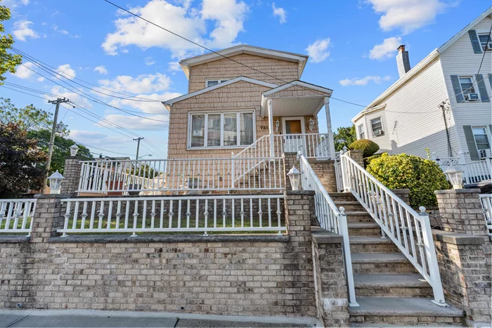 Introducing 733 Ave E, a charming one family residence exuding an inviting aura in the heart of Bayonne, NJ. This home strikes a harmonious balance between comfortable living spaces and thoughtful design. Upon approach, the exterior commands attention with its durable siding and a robust stone wall that borders the front garden area. A raised porch graces the facade, offering an elevated vantage point for admiring the neighborhood while presenting a welcoming entryway to the residence. Relax in the sun bathed sunporch. Inside, you are greeted by a spacious living room, highlighted by a classic fireplace with a detailed wooden mantelpiece that promises cozy evenings on chilly nights. The room is bathed in natural light that streams across the wood flooring, lending it an airy and welcoming feel.  The residence is designed to cater to practical living with an intuitive layout that effortlessly guides you from room to room. Large windows in each space provide a visual connection to the outdoors and infuse the home with daylight. Enjoy every detail of the custom chefs kitchen with slide in gas range and high end hood. Featured here is the second staircase leading from the upstairs directly into the kitchen...The finished lower floor is an extra amount of room for your growing family. Bayonne is 30 minutes outside of Manhattan and one hour from the Jersey Shore Right across the street from the 45th light rail station..and 1 minute on to the turnpike..this home is a commuters dream! Enjoy the best shopping and dining right outside your doorstep!