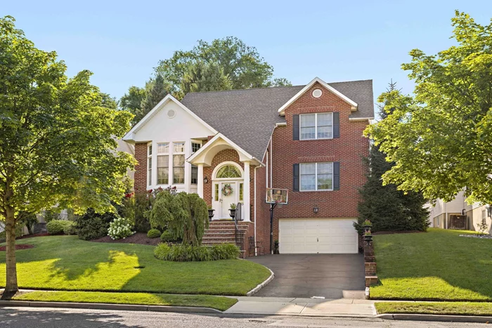 Welcome to this exquisitely designed custom-built traditional home in the heart of Rutherford. Upon entering, you'll experience 18ft ceilings in the formal living room and 9ft ceilings throughout the home with a harmonious flow bathed in natural light from expansive windows, highlighting the rich hardwood floors. The formal living and dining room lead to an eat-in kitchen boasting generous cabinet storage, spacious center island, Viking appliances, large family room with a gas fireplace and a powder room. Upstairs, full main bathroom and three bedrooms include a luxurious master suite with tremendous closet space, perfect for unwinding. The lower level offers two finished rooms, laundry room, half bathroom, and access from your two-car garage. Outside, a backyard oasis awaits with a built-in pool, paver patio, and a gas line for grilling ideal for entertaining! This home masterfully blends classic charm with comfort and elegance at every turn.