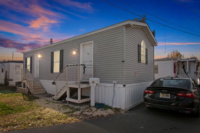 Welcome to this charming 1-bedroom, 1-bath mobile home, thoughtfully upgraded for modern living. Step inside to discover a beautifully renovated kitchen and bathroom, featuring stylish finishes and sleek, stainless steel appliances. The warm ambiance of hardwood floors flows seamlessly throughout, adding both elegance and durability. Complete with convenient one-car parking, this home offers both comfort and practicality. Situated just moments away from the renowned American Dream Mall, enjoy unparalleled access to shopping, dining, and entertainment. Don't miss the opportunity to make this well-appointed space your new home.