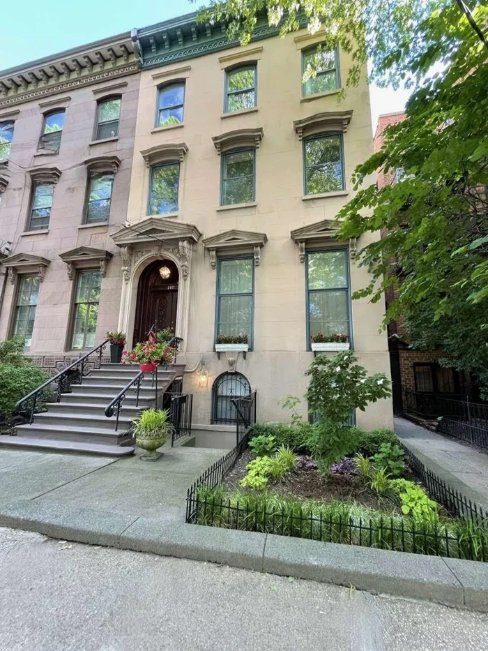 SIZE MATTERS!! (5, 072 sq. feet of living space) especially if you are directly in FRONT OF THE PARK. A truly extraordinary 25' wide Brownstone Townhouse on a 100' deep property, detached on 3 sides. This gem was built across from the center of Van Vorst Park, where only premier townhouses where built on this QUIET tree-lined street (where there are NO buses or two way traffic on this street). Completely renovated in 2004 and just underwent an extensive restoration over (10) months, integrating boundless elegance yet so easy to live in - the public gathering rooms offer the space and comfort for both grand entertaining and quiet gatherings. The impressive parlor, with floor to ceiling windows consists of a formal and an informal living room, a formal dining room and a spacious eat-in kitchen that overlooks a serine bluestone backyard. This four (4) story townhouse has five (5) bedrooms, four (4) full baths, four (4) fireplaces, four (4) skylights, along with front and rear gardens. The gracious bedroom floors include a third floor master suite that faces the green canopy of Van Vorst Park along with an abundance of closets. Additional luxuries of this remarkable brownstone includes a 2 bedroom, 1 bath lower level apartment that could lease for approx. ($51, 000 annually) to entirely cover the annual taxes and insurance expense, or to host your guests, resident nanny or private home office and gym. 3 laundry rooms, audio/video wiring throughout, multi-zone heat and Central HVAC air conditioning system. Four (4) blocks from the Grove Street Path Station & Restaurant Row. Walking distance from The French American Academy & The Scandinavian School of JC. A townhouse of this size, in this location and condition rarely comes on the market. 293 York Street is one of this neighborhood's true treasures.