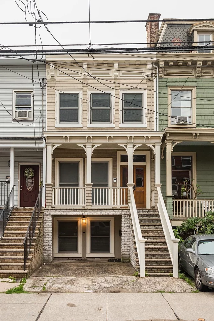 Welcome to this beautifully renovated single-family residence located in the Heights neighborhood of Jersey City. This three-story home features a covered porch upon entry, five bedrooms, and three  bathrooms. The eat-in kitchen welcomes you with beautiful white cabinetry and stainless steel appliances. Other features of this spacious home include washer/dryer on both the lower level and the top level of the home, lots of closet space, one car carport,  and a cozy private backyard.  Conveniently located near several dining options, parks, shopping, and easy NYC commute.