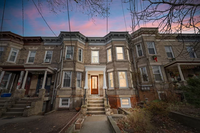 Rarely available single-family home in The Heights! This solid brick townhome is located on a quiet side street, with NYC bus on the corner and walking distance to Journal Square PATH. Original details and doors have been preserved and restored, with updated kitchen and bathrooms for modern living. The home spans 3 levels of living, with a finished lower level that opens to the backyard and private entrance to the street. Top level primary bedroom with ensuite bath, skylight, and closet built ins. The extra deep backyard and garden is a blank canvas to create your urban oasis. Solid brick only comes around once in a while in the Heights, don't miss your chance! ** offering $8, 000 to $22, 000 grants for down payment assistance or closing costs.**