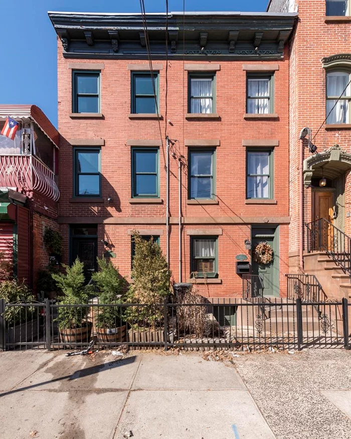 Nestled in the heart of downtown Jersey City, this exquisite three-story brick townhouse offers the perfect blend of timeless charm and modern convenience. Recently renovated with meticulous attention to detail, the property showcases top quality, energy-efficient, and non-toxic materials throughout, creating a warm and serene atmosphere accentuated by the generous use of natural wood and exposed brick. Equipped with smart home technology, the townhouse features a digital keyless entry system, a high-efficiency electric water heater, boiler, triple-glazed windows, and NEST thermostats and fire alarms. The first floor boasts a thoughtfully designed kitchen with stainless steel appliances, custom cabinetry, Quartz countertops, and direct access to a private backyardideal for entertaining. The inviting living room is open to the kitchen and dining area and gives off a cozy vibe with sealed exposed brick. The second floor includes a spacious bedroom, a versatile study that may be used as a bedroom, a convenient laundry area, and a spa-inspired bathroom complete with a steam shower and Jacuzzi tub. The expansive third-floor master suite is flooded with natural light, offering a tranquil retreat with ample space and comfort. Additional features of this exceptional home include two-zone central air conditioning, baseboard heating, a finished basement, exposed brick accents, a skylight, and gleaming hardwood floors throughout. Meticulously maintained, this townhouse is an urban sanctuary that balances historic charm with modern sophistication and access to top rated restaurants, parks, shopping and schools. A few short blocks from the Path, Restaurant Row, Newark Ave Pedestrian Plaza and Hamilton Park, this location is a dream.