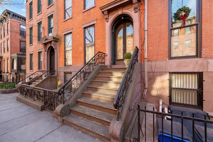 Circa 1853, this stately, 25 foot wide Eastlake brick 4 story townhome sits on a 100 foot deep lot in the coveted Van Vorst Park neighborhood. One of the few magnificent homes that have maintained its original purpose as a single-family residence, this home boasts uncomparable historic detail. Intricate parquet floors with mahogany inlay run throughout, along with plaster moldings, etched glass, pocket doors, floor to ceiling windows with shutters and 7 marble mantles in almost 4, 000 Sq. Ft. of living (not including basement). A two-story brick extension with bay provides additional living space. The garden level of this home features a formal dining room, well designed bright kitchen with center island, laundry area, 1/2 bath and informal dining/den/sunroom. This level provides direct access to patio, professionally landscaped garden with mature plants and irrigation system, as well as a full basement excavated to 7 1/2 feet height providing mechanicals, storage, and potential for home gym/office. The parlor level consists of a marble floor vestibule, two sets of arched entrance doors, elegant foyer and magnificent 16 x33 salon with 11 foot ceilings, gilded cornices, twin mantle mirrors and double floor to ceiling pier mirrors. On this level, you will also find a full bath, den/ library/media room, which could also serve as a 5th bedroom. 4 generous bedrooms and additional 2 full bathrooms complete the top two floors of this home. This well cared for residence also features central and split system cooling, 2 zone heating, central vac and custom closets.