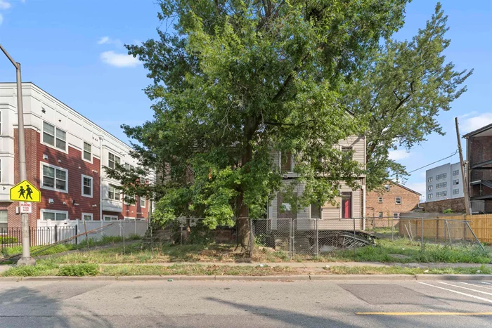 Located in East Orange's Arts and Cultural District great investment opportunity for builder/developer. 12 N Clinton Street sits on a 40x167 lot. Currently vacant with a private driveway, large backyard and enough land to build on the property. There is also the ability to merge with the adjacent lot next door at 10 N Clinton Street which sits on 35 X 71 lot which is a two family fixer-upper. Possible uses areand live/work space, commercial parking, health, medical services, studio, community, daycare, educational, restaurant and many more.  10 & 12 North Clinton:  Adjoining 116 unit new Hue Soul apartments across the street a mixed-use development located in the heart of East Orange, NJ, currently home to a dense & diverse population with over 400, 000 residents within a 3-mile radius. East Orange is on the rise with 2, 936 new residential units completed or in development within the near future. Our Lady of Help of Christians Cathedral Built in the the Gothic Revival style in 1897 in striking white marble, the stained glass is beautifully lit at night and provides both buildings with cathedral views. An active parish provides street supervision that creates a safe and welcoming atmosphere. Located in a vibrant neighborhood with close to schools, parks, public transportation