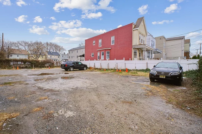 PACKAGE DEAL FOR A TOTAL OF 4 LOTS: 118-120-124-124A Lexington Ave, Jersey City, NJ. This unique property package includes three single-family homes and two adjacent vacant lots, each measuring 26'x99'. Together, the two vacant lots total 102x99'. Situated in a highly desirable West Bergen area of Jersey City, the properties are located directly across from a public library and just 50 feet from West Side Avenue, a bustling commercial street. Public transportation, supermarkets, specialty stores, fine dining, medical offices, and pharmacies are all within a three-minute walk, while Lincoln Park, offering a wide range of sports and recreational activities, is only two blocks away. The first property, 118 Lexington Avenue, is a spacious mother-daughter home featuring five bedrooms and 2.5 bathrooms. The finished basement includes a bedroom with ample closet space, a kitchenette, and a full bathroom, accessible via a private alleyway door. The home boasts newer insulated windows, a modern kitchen with access to the back deck and yard, and rosewood parquet flooring in the living and dining rooms. Additional features include recessed lighting with dimmers, upgraded closets in the master bedroom, and an enhanced second-floor bathroom. The property also offers a two-car driveway, a backyard with a concrete slab for barbecues and recreation, and a rear deck with lighting. Appliances such as two refrigerators, a washer, and a dryer are included. At 120 Lexington Avenue, you will find a double lot measuring 52'x99'. This fenced property includes an 18-foot commercial-grade sliding gate and provides parking for up to 22 cars, making it an excellent option for residential or commercial use. 124 Lexington Avenue is a single-family brick home with high ceilings. The first floor features a living room, dining room, and kitchen with access to the backyard. The second floor includes three bedrooms, a full bathroom, and a skylight above the staircase. The home also has a high-ceiling, unfinished basement. 124A Lexington Avenue mirrors the layout of 124 Lexington Avenue, with a high-ceiling unfinished basement that includes a 3/4 bathroom with a shower stall, sink, and toilet. All homes in this package will be delivered vacant at closing, providing a rare opportunity for investment or redevelopment in a thriving Jersey City neighborhood.