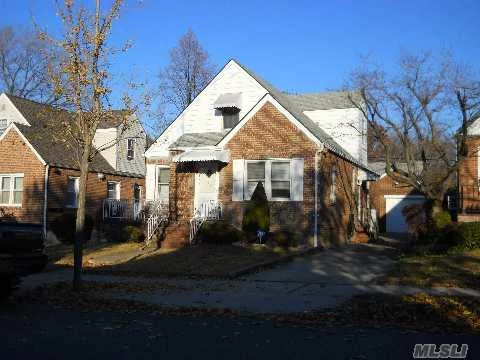 Lovingly Maintained Cape W/ Dr & Eik On Center Of Block Location. New 1st Roof, Newer Gas/St Heat. All Replacement Windows Clean. Nice Yard. School District 26. Ps 162, Jhs 74.