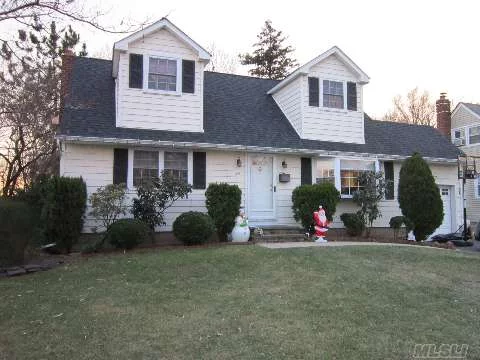 Great Location, Mid-Block. Park-Like Backyard. Close To Lirr, Schools And Stores. New Windows, Siding, Roof, Extra Large Doggy Dormers.