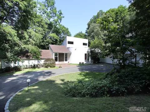 Stunning, Unique, Brian Shore Contemporary Home. Manhattan Loft Meets Hampton&rsquo;s Beach House.The Tennis Court & Lovely In-Ground Pool Are Nestled Within 2 Acres Of Wooded Property. Perfect For Entertaining Inside Or Out. 24 Hour Notice For Appointments Please!