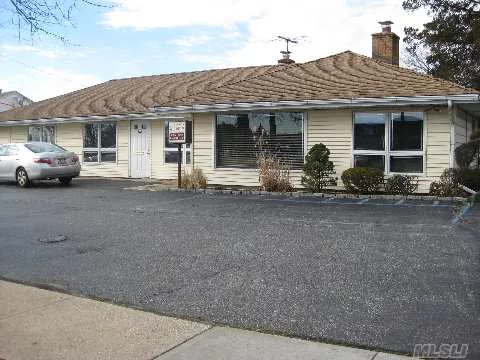 Prime Office Building-Commercially Zoned Property In Extremely High-Traffic Location Across From The Plainview Shopping Center-Perfect For Business & Professional Use- Great Exposure & Free-Standing Bldg., Generator, Shed & Fiber Optic Service- Parking On Premises- Great Location