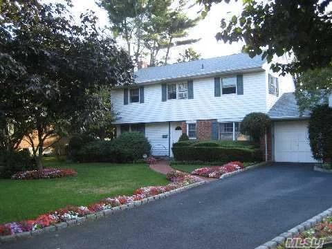 Priced To Sell!! Large Colonial Style Home With Great Flow Located On Beautiful Tree Lined Street In Desirable Kings Park School District #5. This Home Boasts A Formal Dr, Raised Formal Lr W/Fireplace, Extended Fam. Rm., Lg. Eik W/ Breakfast Room , Huge Master Br, Lots Of Wic, 2 Additional Bdrms, 1.5 Bths, New Burner & Much More! Set On Flat .25 Acre! Taxes W/ Star $9, 421