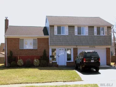 Move Right Into This Bright & Spacious Split Located In Quiet Cul-De-Sac. Brand New Kitchen And Bath, 4Br&rsquo;s, Mbr W/Full Bath. Hardwood Floors, Newly Finished Basement, New Windows And Roof. Near Lirr, Pkwys & Shopping.