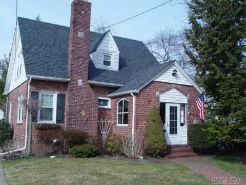 Charming Mint Tudor Style Colonial, Mid-Block, Enclosed Front Porch, Entry Hall, Formal Dining Room, Hw Floors, New Granite Kitchen W/Ss Appliances, Office/Br, Den Overlooking Private Yard W/Deck, 2nd Floor 3 Large Bedrooms, Attic Storage. Updates Include Baths, Roof 1Year, Windows, Heating 4 Years, Ac, Igs. Walk To Lirr.Sd# 7 Jfk.