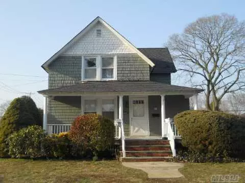 1890&rsquo;S Colonial With Great Covered Front Porch. This 3 Bedroom And 2 Full Bath Home Has A Wonderful Open Floor Plan. The Huge Country Kitchen Has A Walk In Pantry And A Mud Room That Leads To The Back Yard. Hardwood Floors Throughout, 2 Car Detached Garage And A New Roof. Extremely Well Kept Home Located Close To Main St In A Nice Neighborhood. Dont Miss This Opportunity.