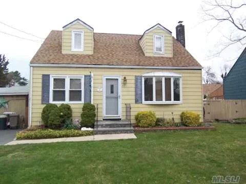 Beautiful Move In Condition Cape! Country Club Backyard W/New Ag Pool! Hardwood Floors Thruout, Updated Kitchen, 6Yr Roof.