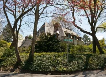 Reminiscent Of An English Country Home, This All Brick Tudor, Built In 1927 Embodies The Details Of Its Period To Perfection. A Stone Carved Family Crest Welcomes Its Visitors Into The Beautiful Formal Rooms Replete With Original Beamed Ceilings, Wide Plank Floors And Appointments. This Special Home Is To Be Treasured For A Lifetime.