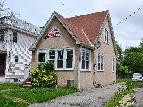 Charming Cape Situated On A 40X100 Property With A Long Driveway & Spacious Backyard. It Has An Enclosed Porch, Living Room, Dining Room, Bedroom On The First Floor, Eat-In-Kitchen & Bath. On The Second Floor There Are Two Bedrooms & Storage Attic. It Has Lots Of Potential & Does Need Updating. Conveniently Located To Two Public City Buses, Major Highways & Shopping.