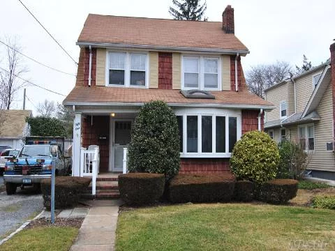 Beautiful Colonial In The Heart Of Roslyn Heights 7500 Square Foot Lot Features A Formal Dining Room, Eat In Kitchen, Skylight, And Wall To Wall Carpeting With Hard Wood Floors Underneath. The Second Floor Has Three Large Bedrooms With Full Bath. Mid Block Location, Close To Lie And Lirr, Shopping. Great School District. Full Basement A Must See!