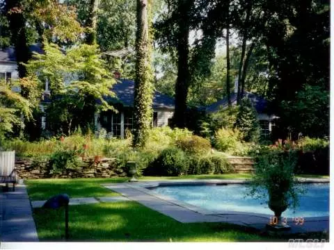 Wonderful House On Beautiful Grounds With Heated Pool And Tennis Court In Lattingtown Harbor.
