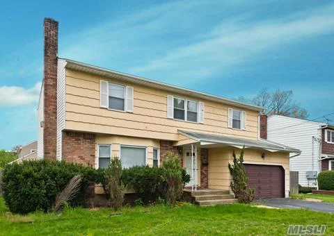 This Large Colonial Features: Full, Finished Bsmt, Eat-In-Kitchen, Large Livingrm, Formal Diningrm, Den, 1 Large Mastersuite W/ Walk-In Closet & 1 Full Bath, Plus 3 Large Brs, Plus 1.5 Baths. Also Hardwood Floors, Updated Windows, Inground Sprinklers & 2.5 Car Garage. Centrally Located. Great Layout