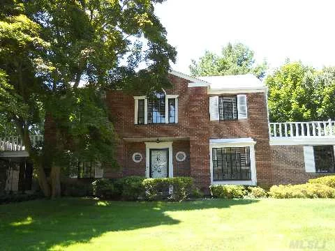 Center Hall Brick Colonial With 4 Bedrooms And Maids Room And 3 Full Baths. Living Room W/ Fp, Formal Dining Room, Eat-In Kitchen, Screened-In Porch. 2 Car Garage.