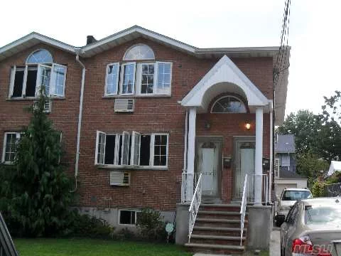 Beautiful All Brick Legal 2 Family Duplex, 6 Over 6, 4.5 Baths, Finished Basement, Garage.