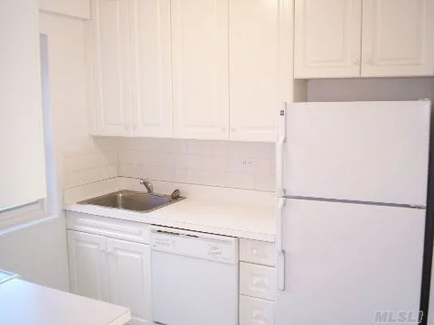 Beautiful Large Jr. 4 Unit. All New White Contemporary Kitchen & New Bathroom. New Wood Floors Thoughout. 5 Closets. Indoor Garage Available @ $135.Oo Per Month. Dishwasher & Built-In Microwave. Laundry Room On Premises. Only 2 Blocks To Lirr. Great Neck Schools.