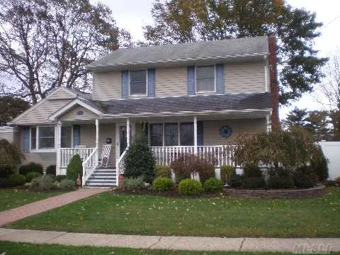 Farmingdale Colonial 4 Bedroom, 2 Baths. This Beauty Includes, Updated Kitchen With Stainless Steel Appliances, Quartz Counter Tops, Hardwood Floors, 2 Updated Baths, Oversized Formal Dining Room And Living Room, Full Finished Basement And Front Porch And Fenced Rear Yard.