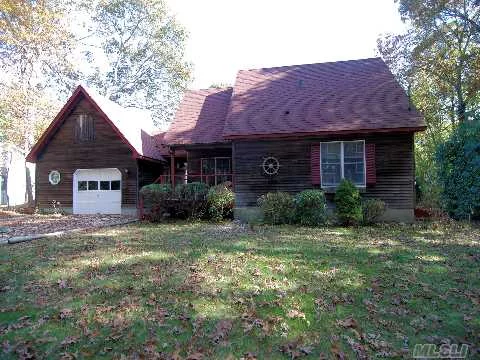 Great 2/3 Bedroom, 2 Bath Home In A Desirable Location. Vaulted Ceilings, Fireplace, Hardwood Floors And Lots Of Windows With Charming Front Porch. Private And Spacious Yard With 2 Decks And A Sound Beach At The End Of The Road! Come See All That This Great House Has To Offer!!