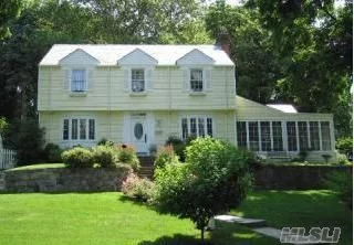 Charming Center Colonial Sits On High Ground With Open View. 4 Bedrooms 3.5 Updated Baths, Attached 2 Car Garage, Hardwood Floors Throughout, Conveient To Lirr, Town, Parks. 30 Minutes Train Ride To City, Parking At Plandome Station, Manhasset School District #6.