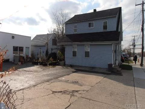 The Site Is Improved With A Two Story,  Two Family House And A 1.5 Story Cottage And A One Story 1, 200 Sq.Ft Industrial Building, Paved Parking Lot For 4/5 Cars. Good Income Investment Property.