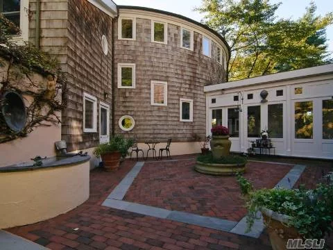 Designed By Architect Pietro Gicognani On 8 Acres At Peacock Pt.House Has A Strong Post Modern Character With Elements Strung Out On A Knoll. The Curves Of The Design Suit The Site. Fireplaces Are Soapstone In Green Gray Colout. Floors Are Oak And Library Railings Mohogany W/Ebonized Mahogany