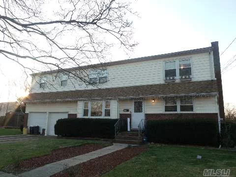 This Lovely Legal Two Family Situated In The Heart Of Farmingdale Village Features 4 Bedrooms, Large Living Room, Washer And Dryer, Off Street Parking.