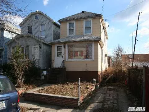 Detached One Family Home Needs Work. 3 Bedrooms, 1.5 Baths, Living Room, Dining Room, Eat-In Kitchen, And A Full Basement. Private Driveway. Short Bus Ride To #7 Train.