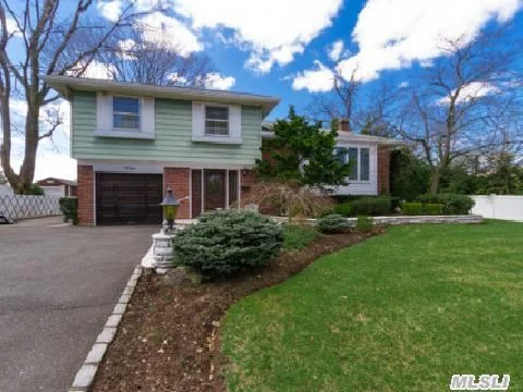 Beutiful Split In Famed Jericho Sd #15.Close To Shopping, Lirr, Lie Pkwy!Mostly Hrdwd Flrs.3 Brs, 2 Zone Heating, Cac, Central Vac, Ing Sprinklers, Alarm System, Wood Mode Built In W Stereo System. Beautifully Professional Landscaped. Property W Blue Stone Patio, Marble Approach & Marble Retaining Wall In Front. Too Many Ameneties To List.A Must See!Taxes W/Star $12, 155.88