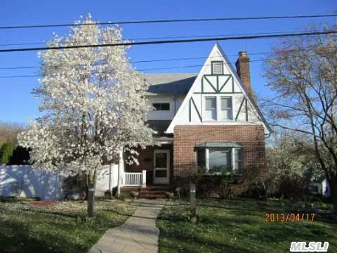 Large Back And Side Yard With In Ground Swimming Pool. Open Floor Plan With Kitchen Counter That Sits 12. Full Finished Partial Above Ground Basement W/Ose. Close To All. Shopping, Lirr, Transportation, Park.