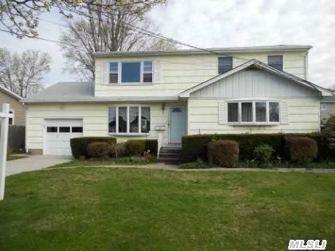 Large Families Must Stop Here!!!! Spacious Mother/Daughter Home With Permit Renewal....Can Also Be A 6 Bedroom Colonial With Removal Of 2nd Kitchen. Quiet Dead-End Street. Extended Country Kitchen, Updated Bathroom. Anderson Windows. Wood Floors Through Out.